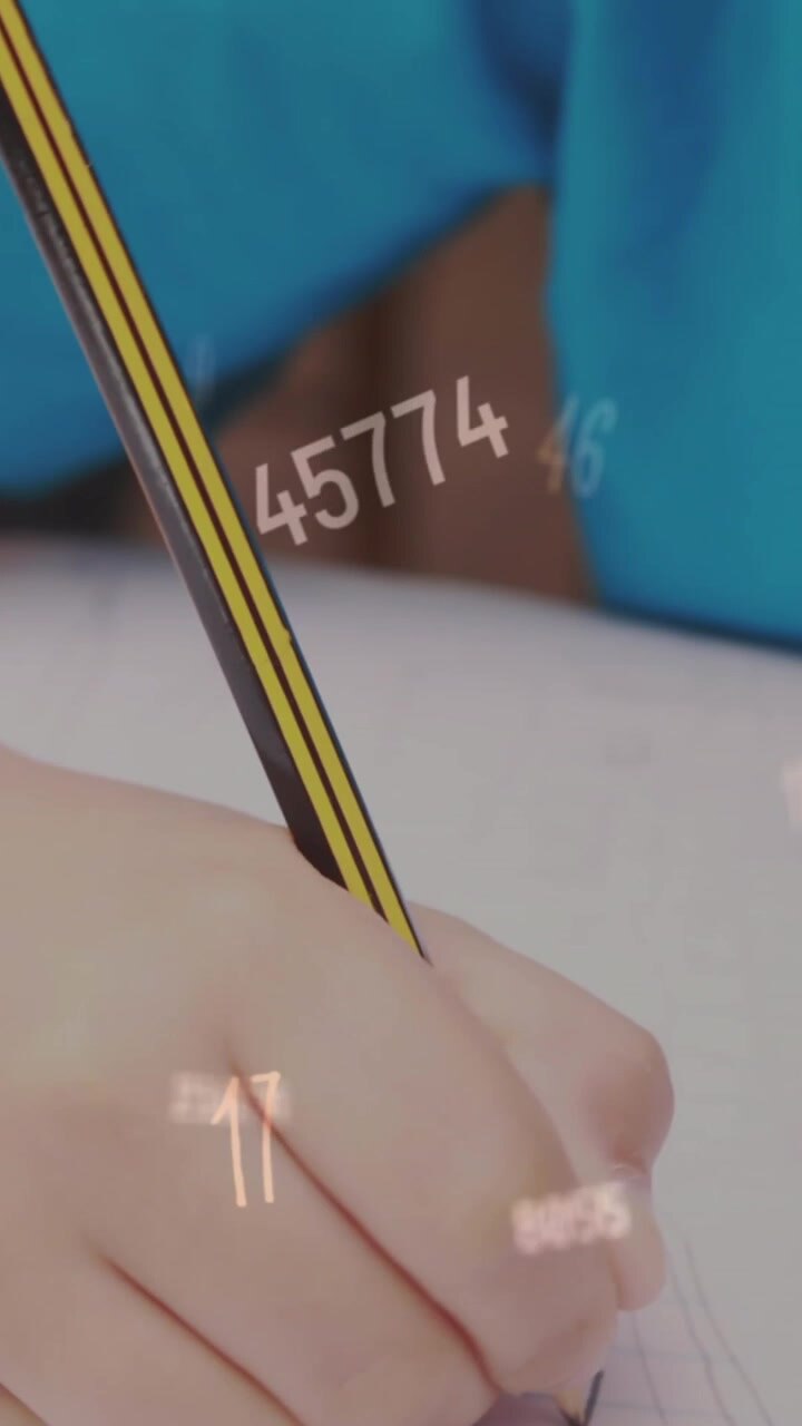 Animation of changing numbers and symbols over caucasian student writing in book