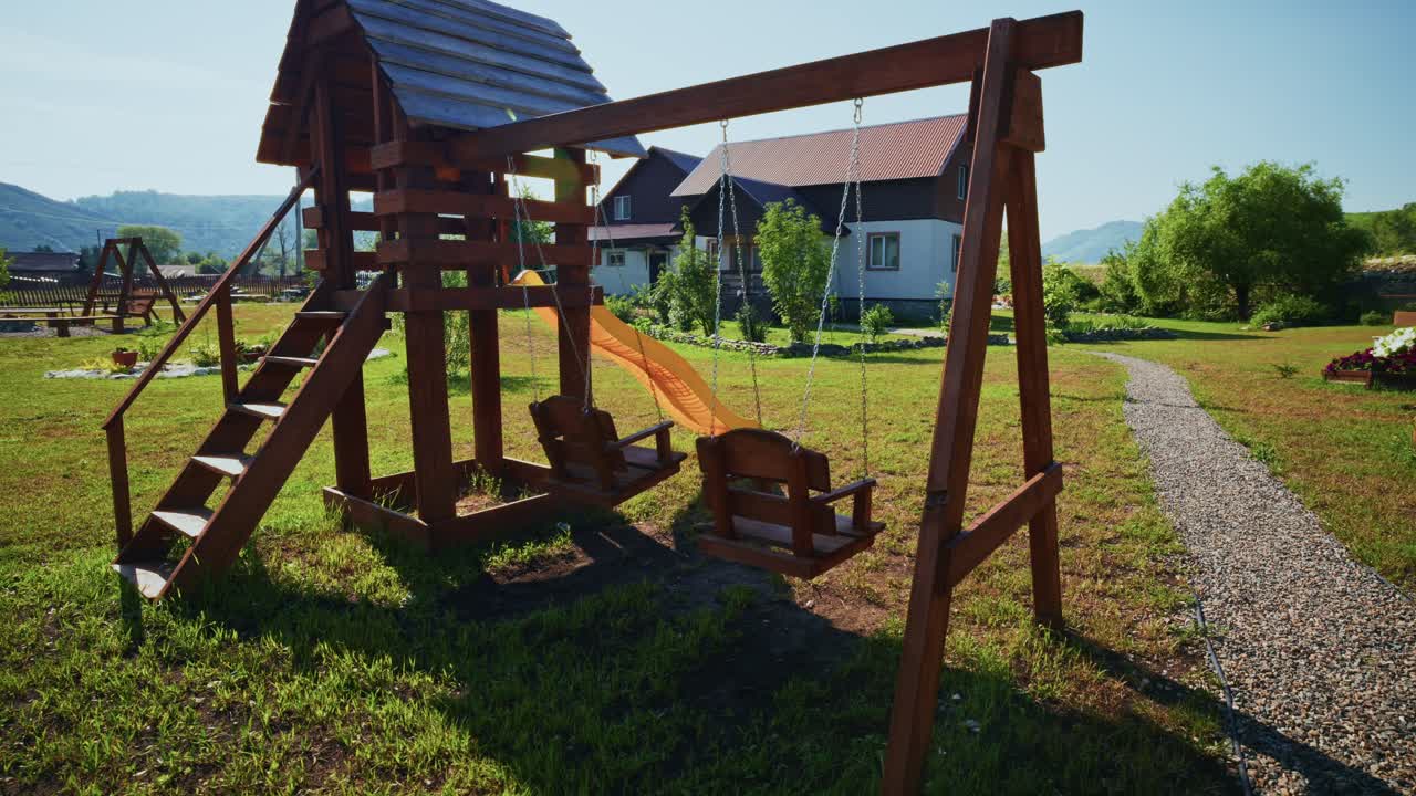 Empty Wooden Playground with Swings and Slide in a Sunny Backyard