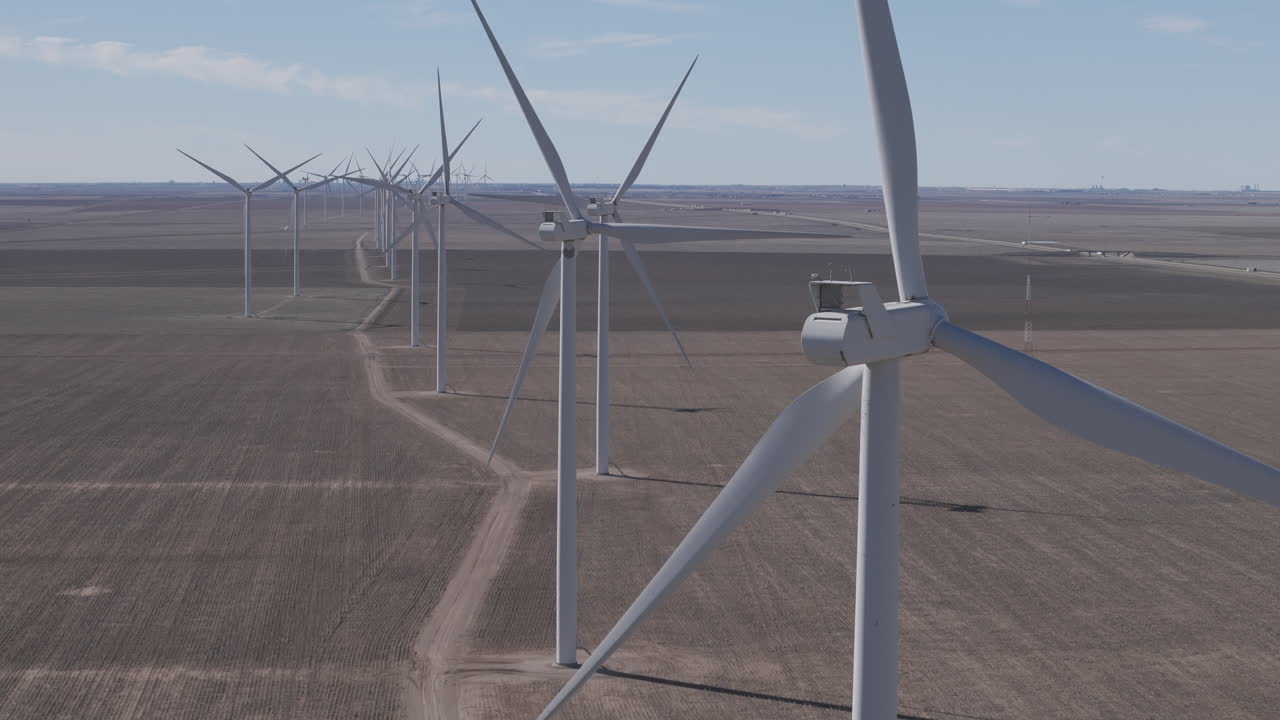 Texas WInd Farms - Telephoto Track Sideways Past Long line of Turbines