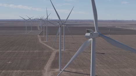 texas wind farms - telephoto track sideways past long line of turbines