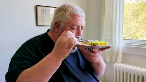 seated by the window, a middle-aged man consumes his meal, his loneliness almost tangible. a visual representation of someone facing personal difficulties alone.