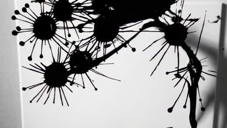 abstract black ink splatters on white background