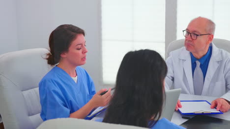 Medical-nurses-doing-teamwork-wearing-blue-uniform