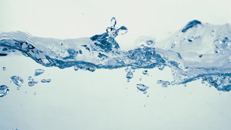 many bubbles in water close up, abstract water wave with bubbles in slow motion