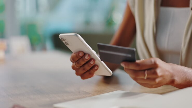 Woman making a mobile payment with credit card