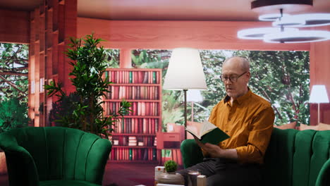 senior person enjoying lecture with a book and relaxing on couch at home