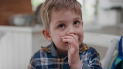 portrait-funny-little-boy-smiling-happy-looking-playful-kid-with-childhood-curiosity-at-home-adorable-child-testimonial-concept-4k