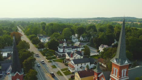 Drone-shot-backing-away-from-the-churches-of-Downtown-Palmyra-New-York