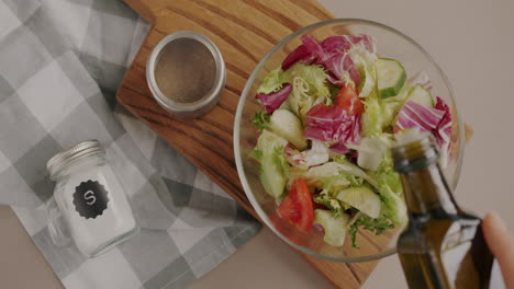 making a salad with olive oil