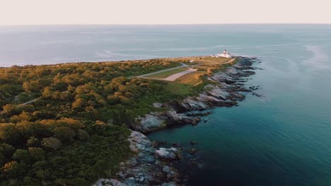 Beautiful-aerial-footage-of-Beavertail-Lighthouse-during-sunset