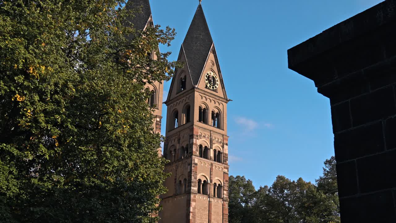 The historic Basilica of St. Castor, the oldest preserved church in Koblenz, Germany, prominently featuring its twin Romanesque western towers
