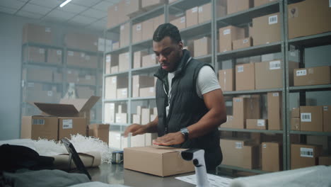 warehouse worker packaging orders
