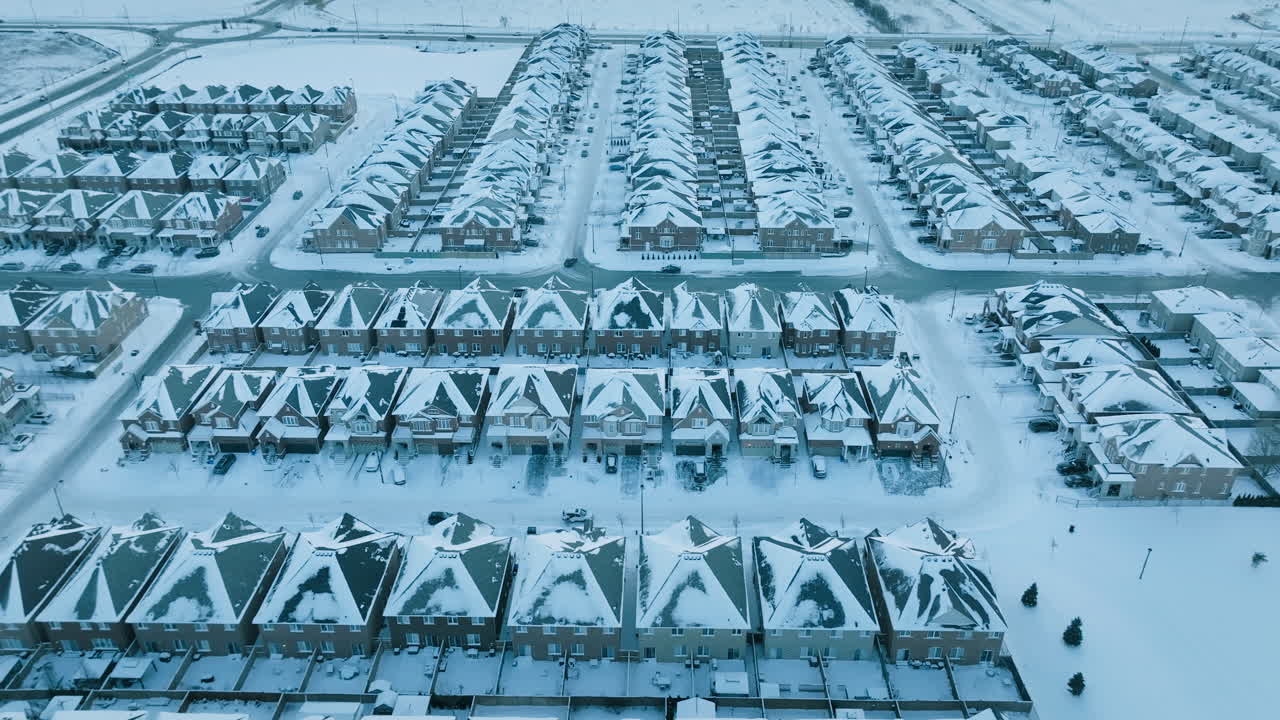 Aerial view of snow-covered suburban homes in Milton, Ontario, Canada