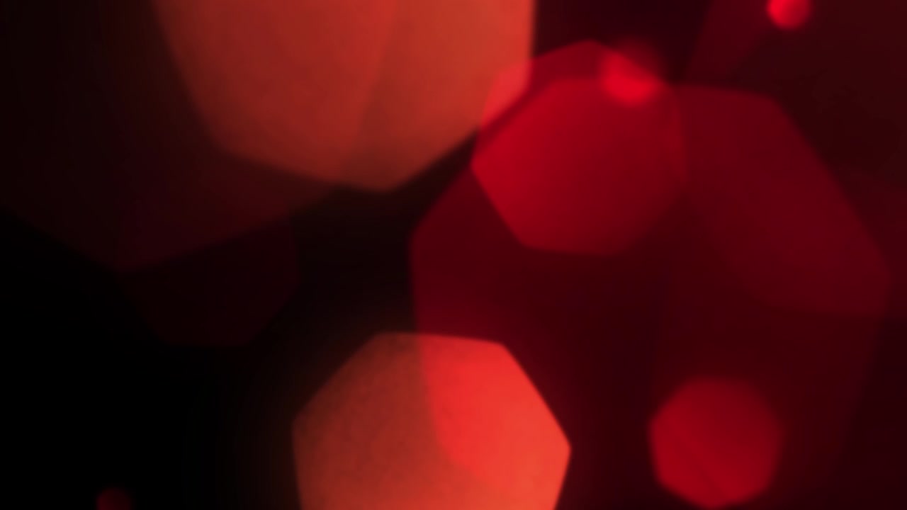 Vazamentos de Luz Bokeh Vermelhos Abstratos em Fundo Preto