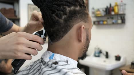 anonymous hairstylist doing a haircut