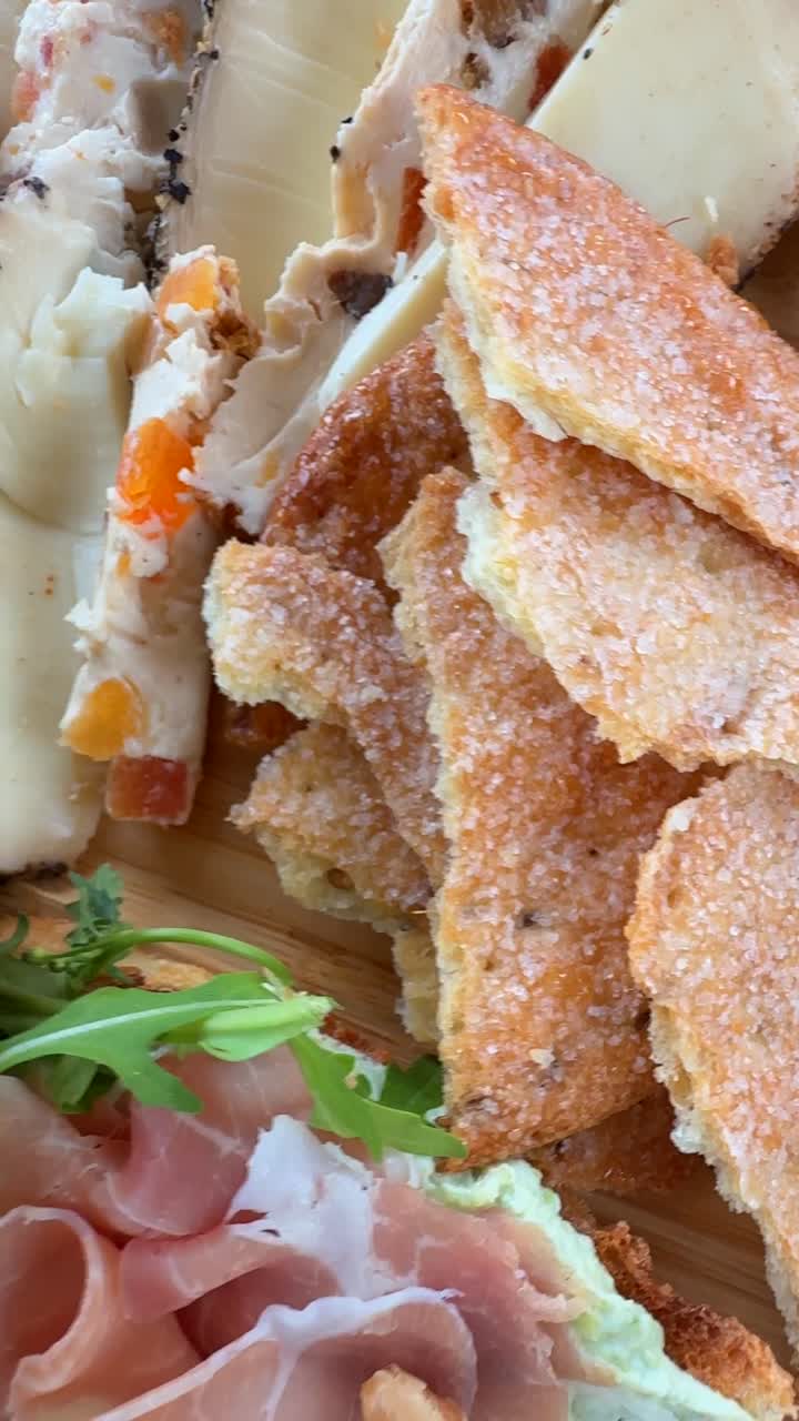 Delicious Appetizer Platter with Cheese, Nuts, and Ham