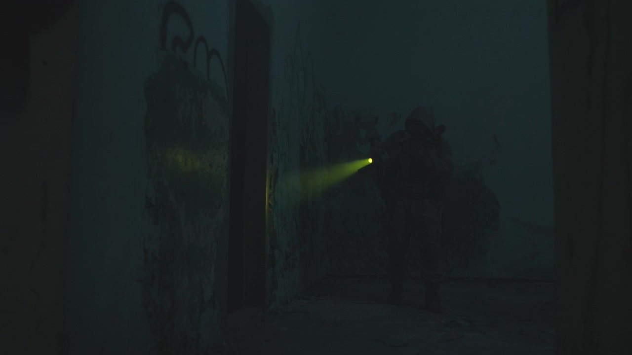A wounded soldier in the abandoned military complex during the recon mission