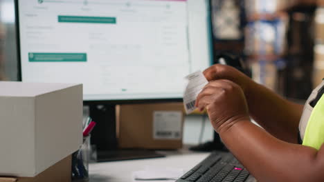 african american staff works on packages labeling for express delivery