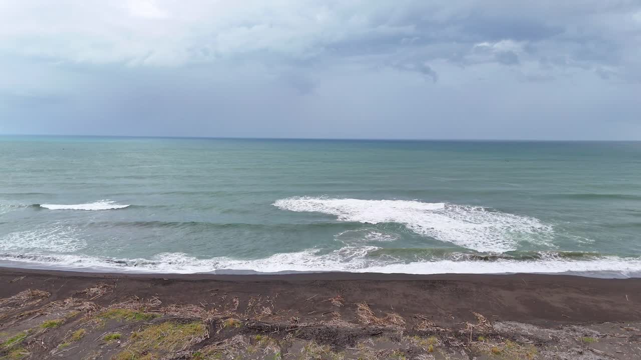 Drone flight along the surf of Baros Beach in Yogyakarta, Indonesia.