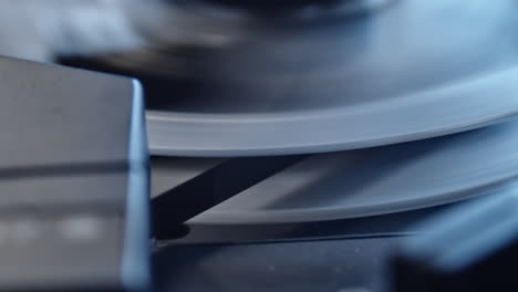 rewinding crime evidence on magnetic tape in recorder, closeup of play head