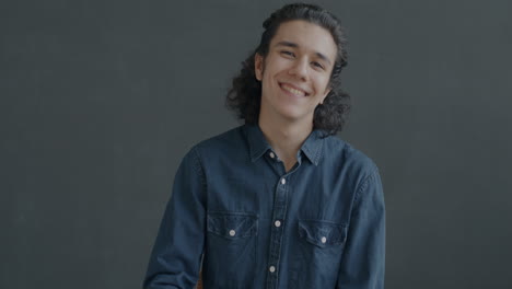 smiling teenager with ok hand gesture