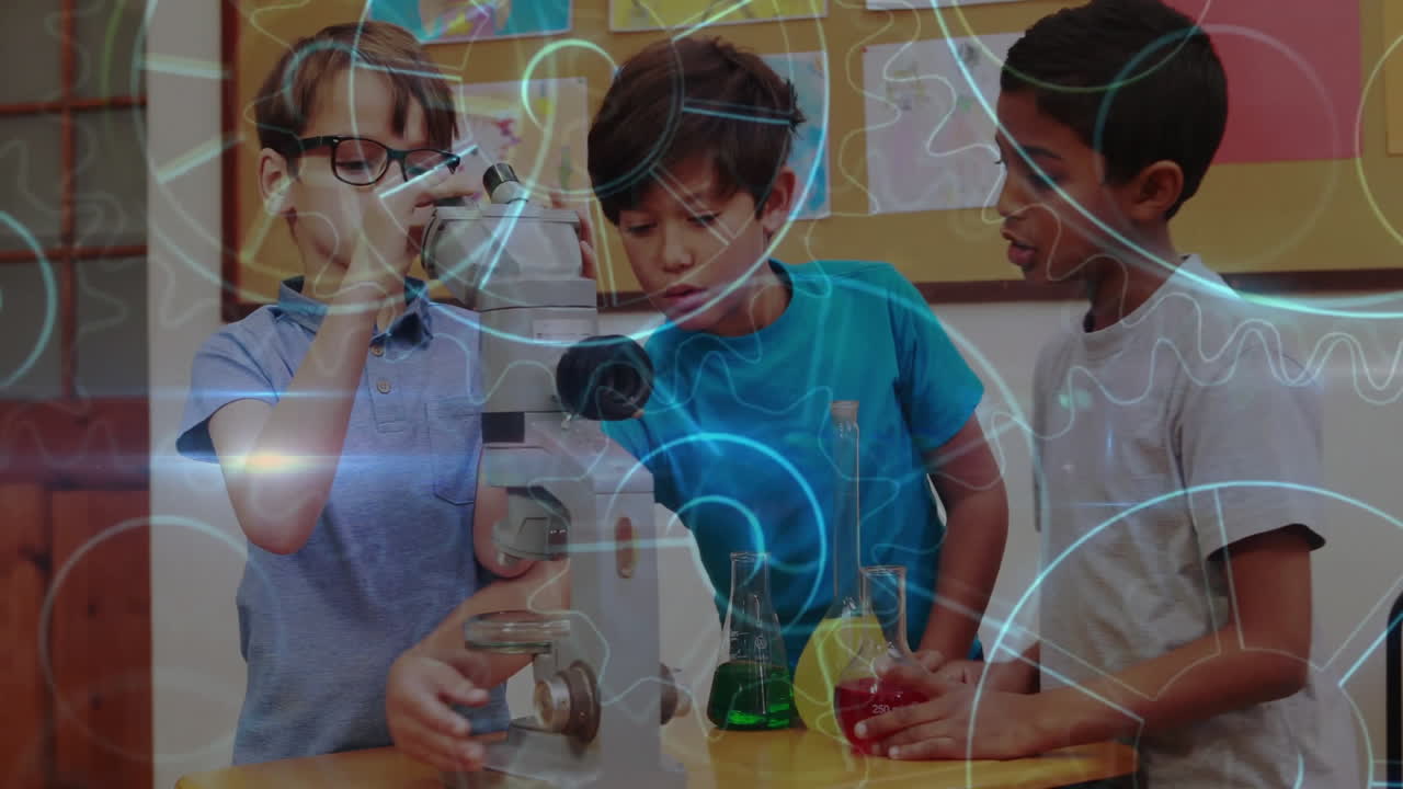 Focusing microscope, adjusting focus knob and pouring red liquid, boys exploring science education