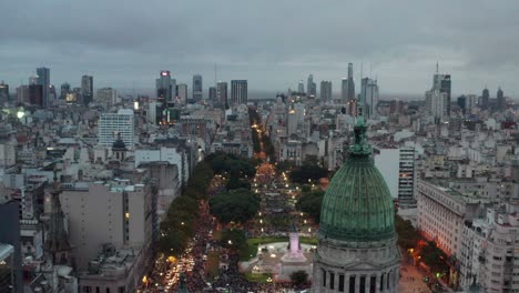 aerial at dusk around the dome of the palace of the argentine national congress at plaza congreso, buenos aires, argentina