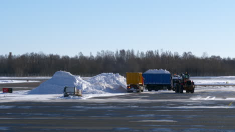 Airport-snow-clearing-scene.-Slow-pan-left