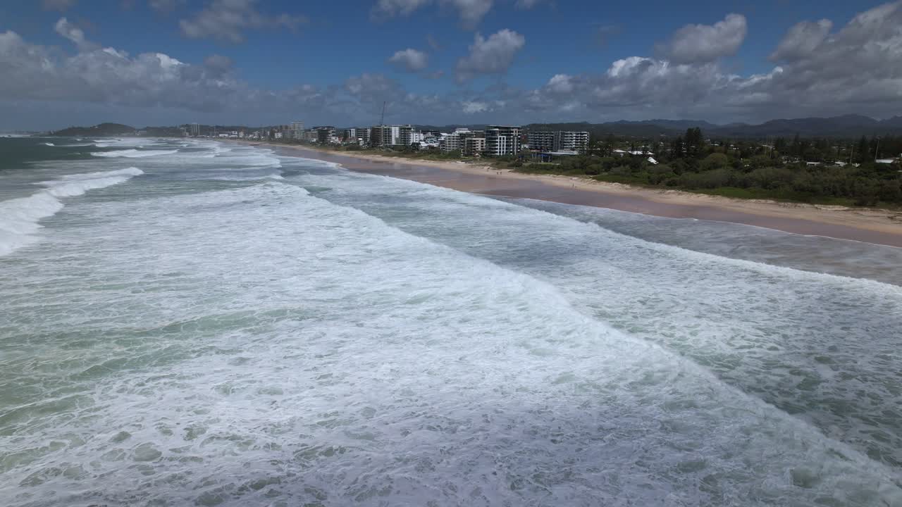 Foamy Waves Crashing Onto Sandy Shore Of Palm Beach During Cyclone Alfred In Gold Coast, Queensland. aerial shot