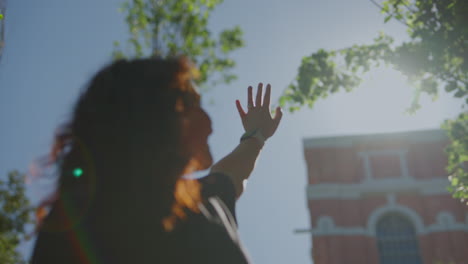 woman reaches for the sun