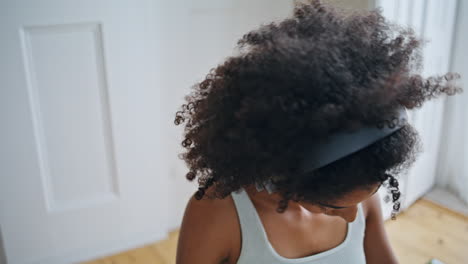 Closed-eyes-girl-warming-neck-up-at-morning-closeup.-African-woman-stretching