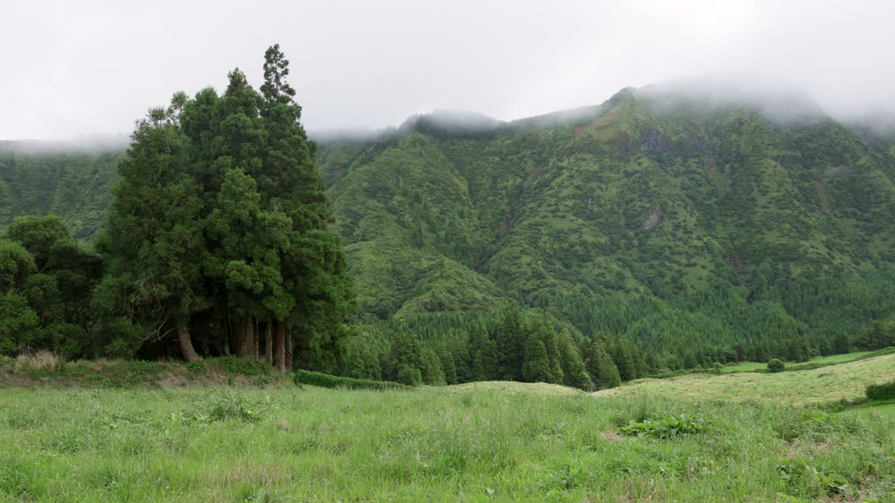 Time Lapse of moving clouds over forested mountains in the Sete Cidades lagoon scenery, Azores