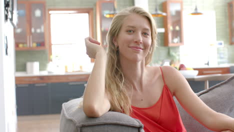 young caucasian woman smiles warmly in a home setting