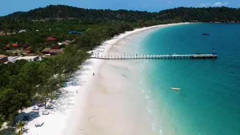 Aerial-side-profile-of-wooden-pier-on-4k-Beach,-Kong-Rong,-Cambodia