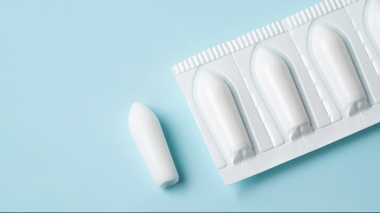suppositories medicine on blue table