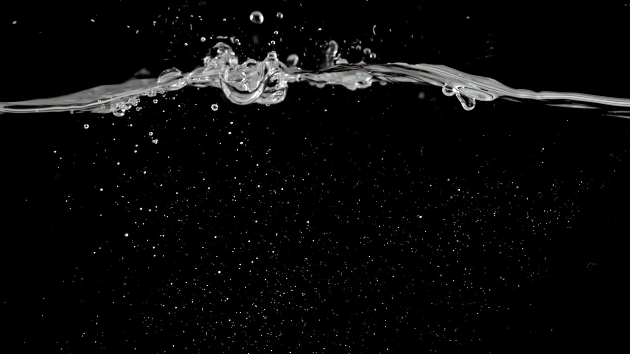 Clear Water Pouring and Splashing on Black Background