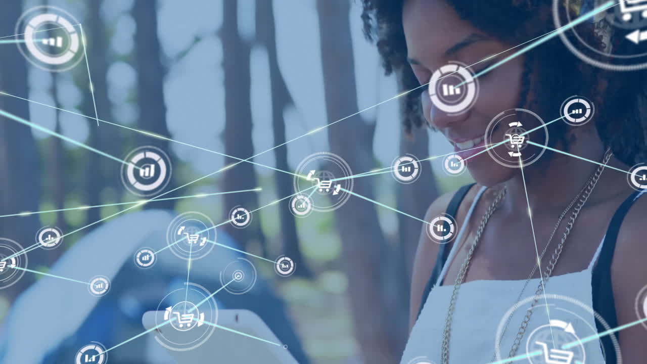 animación de la red de conexiones con iconos del globo sobre mujer biracial con tableta