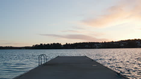 Concrete-jetty-leading-into-the-archipelago-sea,-in-slow-motion