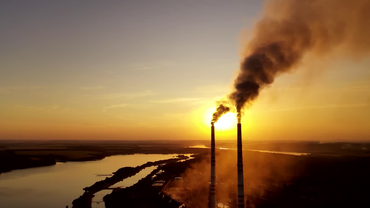 Power plant emission. Aerial view of smoking chimney of power plant