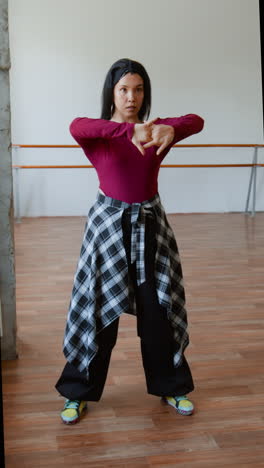 woman practicing dance in a studio
