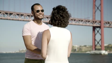 multiethnic couple talking outdoor