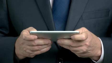 close up businessman hands holding smartphone.