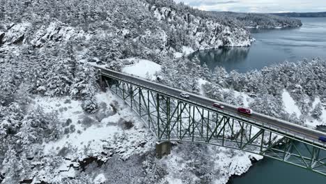 Aerial-shot-of-vehicles-traveling-across-Deception-Pass-bridge-in-Washington-State