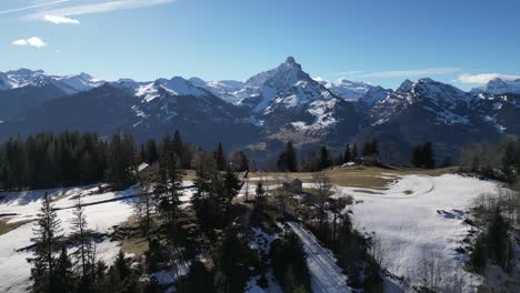 Amden-Weesen-Switzerland-gorgeous-reveal-flight-over-propery-on-cliff-to-show-off-scenic-mountains