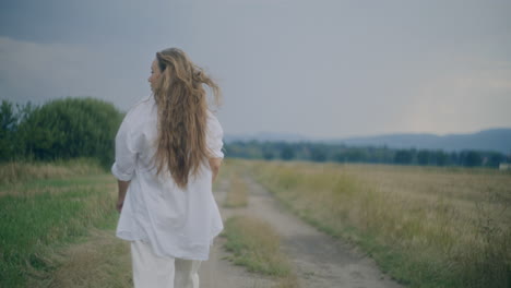 woman walking outdoors in windy day