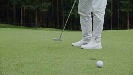 golfer putting on a golf course