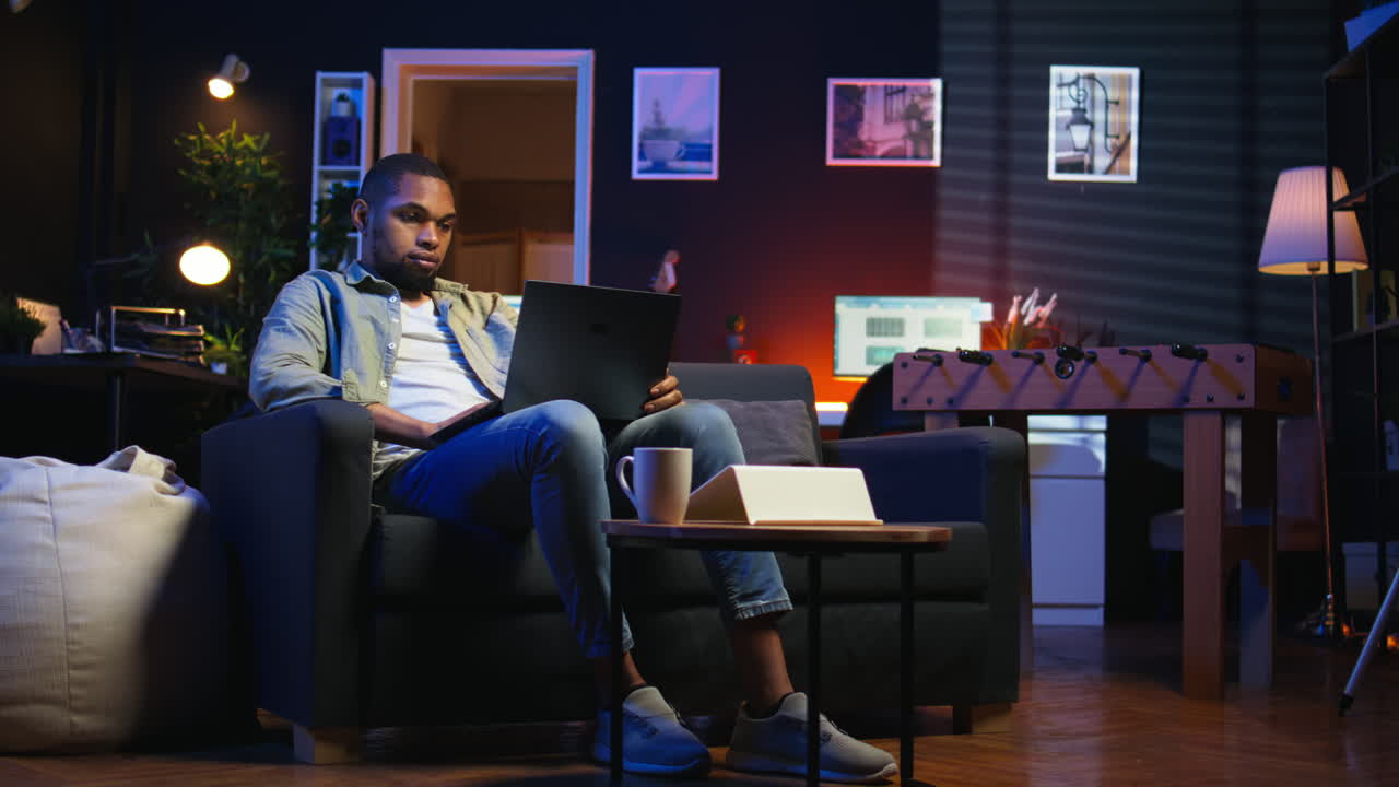 Vertical Video Self employed guy browsing the web and listening to music