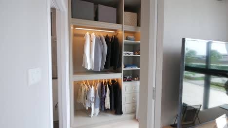 minimal and stylish bedroom's walk-in closet idea