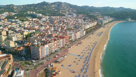 close-up-of-the-beach-of-Lloret-De-Mar,-summer-on-the-coast,-brava,-aerial-images,-sea-promenade