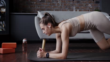 woman doing a plank exercise at home